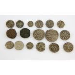 Group of antique mostly white metal Islamic coins.