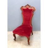 19th century oak framed nursing chair with shell crest on cabriole legs