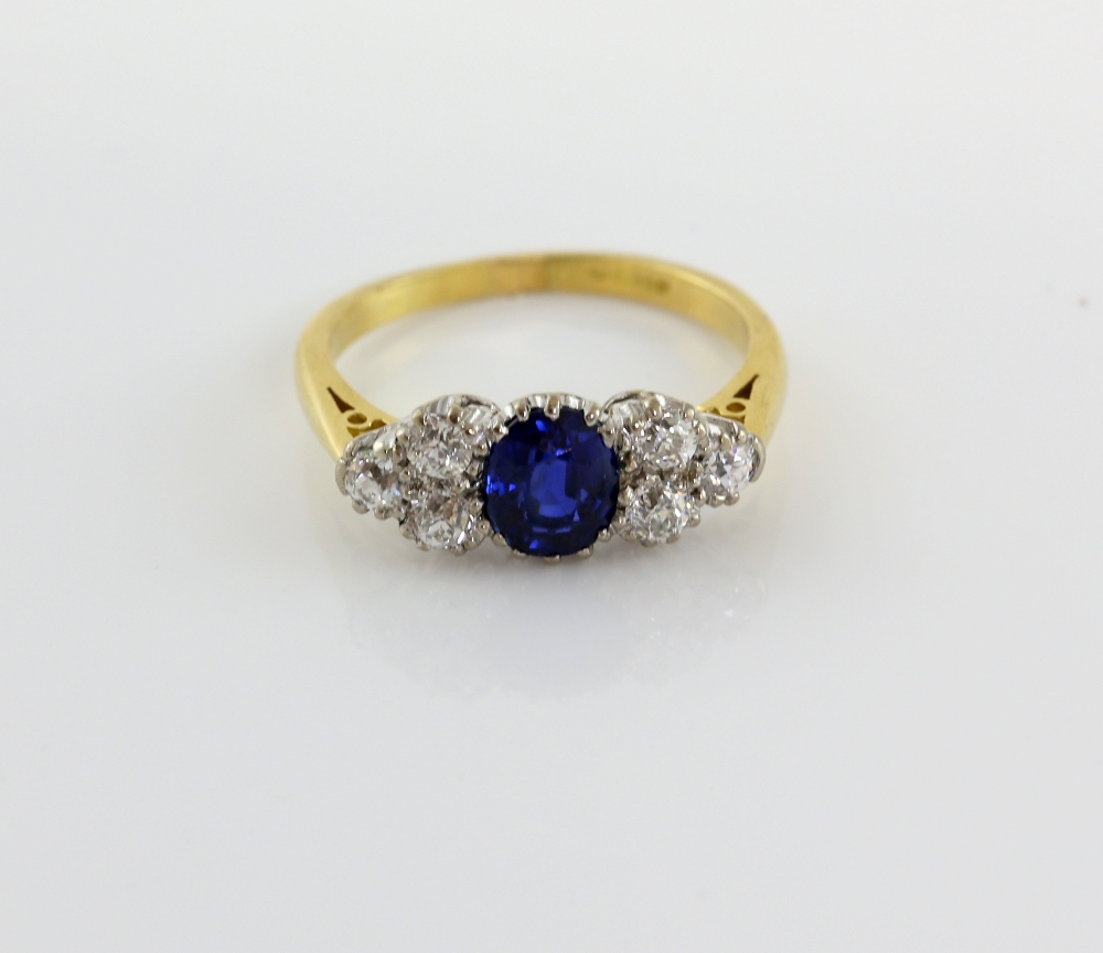 Sapphire and diamond dress ring, central oval cut sapphire, estimated weight 1.42 carats, set with