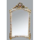 Continental parcel gilt wall mirror profusely carved and painted with flowers, the crest with a