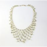 Aquamarine fringe necklace, oval cut aquamarines, rub over set in yellow metal stamped 14 ct,