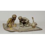 Bergman style early 20th century cold painted bronze Arabs playing dice, seated on a rug, Austrian