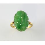 Carved jadeite jade plaque ring, measuring approximately 1.9 x 1.3cm, stamped 18 ct and platinum,