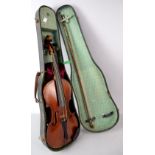Early 20th century violin label reading Commaso Carcassi 60cm with bow in fitted case .