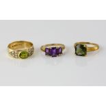 Peridot and diamond ring, oval cut stone rub over set, with round brilliant cut diamond set