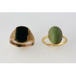 Two rings, oval cabochon cut green hard stone ring, mounted in yellow metal testing as 14 ct, size