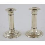 Pair of Edward VII silver dwarf column candlesticks on plain round loaded bases, by I S