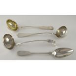 A continental silver ladle, with vacant shield finial, 33 cm long, together with two further ladles,