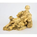 19th Century Japanese carving of man resting on a bale of sticks, signed 10 x 20 cm .