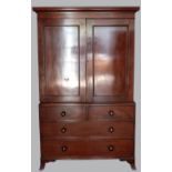 19th century mahogany linen press, with cupboards enclosing slides over two short and two long