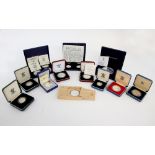 Seventeen mainly 1oz silver commemorative coins and a 5oz silver proof ten pound coin (18 in lot) .
