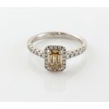 Fancy coloured diamond ring the central step cut stone, cognac, slightly pink, estimated at 1.00
