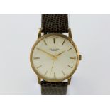 J W Benson Gentleman's 9ct Gold cased dress watch , the circular dial with batons, minute track with