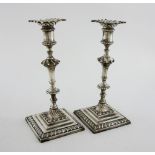 Pair of Edward VII silver candlesticks, with knopped stems on gadrooned square bases, by Elkington &