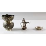 Indian white metal spittoon with embossed decoration, small dish inset with a coin and a Sterling