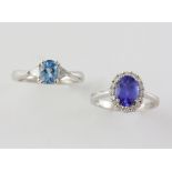 Two gem set rings, a tanzanite and diamond cluster ring, oval cut tanzanite estimated weight 1.47