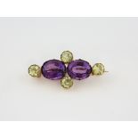 Victorian amethyst and chrysoberyl brooch, two oval cut amethysts estimated weight 14.52 carats, set