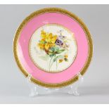 19th Century pink ground cabinet plate, the centre decorated with flowers, highlighted in gilt,