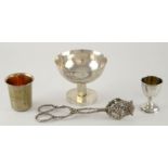 A group of German silver items to include a planished pedestal bowl, 9 cm high, a teacup and a