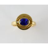 Sapphire and diamond eye ring, oval cut blue sapphire, estimated weight 1.24 carats, with round