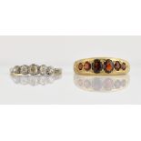 Edwardian diamond set ring, with five stones in claw setting, stamped 18 ct, and a later garnet