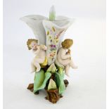 Early 20th Century Dresden porcelain vase with three applied cherubs, NH mark to base 24 cm high .