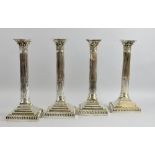Set of four silver plated Corinthian column candlesticks, on stepped square bases, 25cm high,.