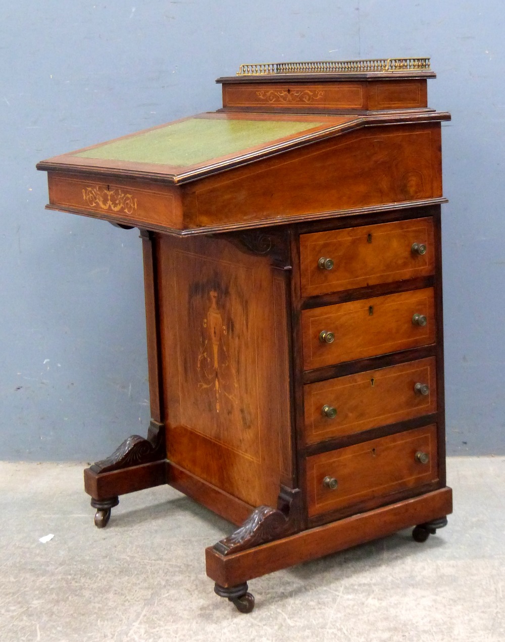 Victorian rosewood Davenport with marquetry inlaid decoration, raised back and four drawers on