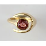 Contemporary asymmetric ring, centrally set with oval cut synthetic padparadscha coloured
