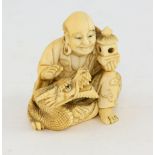 19th Century Japanese carved netsuke of a man with a dragon, signed 4 cm .