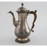 George III silver coffee pot of baluster form with gadrooned decoration, by Thomas Whipham & Charles