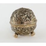 Victorian silver string box, circular on three ball feet, embossed with birds and scrolling foliage,