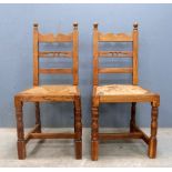 Pair of oak dining chairs by Hewetson Milner and Thexton