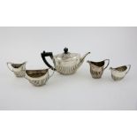 Victorian silver three piece tea service, comprising tea pot, cream jug and sugar bowl, with half-