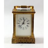 19th century French gilt bronze carriage clock, with 8 day movement, the case bright cut engraved