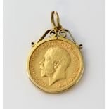 Gold pendant mount, with George V 1911 half sovereign, measuring approximately 3 x 2cm. Gross weight