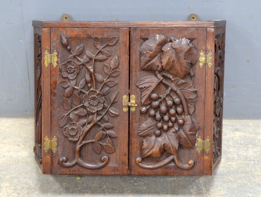 Black Forest style carved oak wall hanging corner cupboard with flowers and vines, 38cm x 50cm. - Image 3 of 3