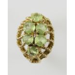 Vintage peridot spray brooch, round and oval cut peridot, looped wirework, measuring approximately