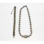 Early 20th C French paste necklace, with floral links, measuring approximately 43cm in length,