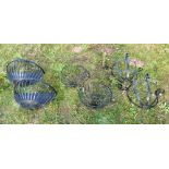Three pairs of modern wrought and cast iron garden wall pockets and a planter 69cm high,