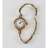 Ladies 9ct gold wristwatch, the circular enamel dial with applied Roman numerals and minute track,
