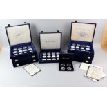 Eight presentation boxes containing mainly silver commemorative coins.