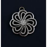 Diamond flower swirl pendant set with round brilliant cut diamonds, estimated total diamond weight