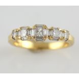 Diamond dress ring, set with five princess and twenty baguette cut diamonds, estimated total diamond
