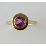 Pink sapphire dress ring, round cut sapphire, estimated weight 1.20 carats, mounted in rub over