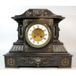 Black slate mantle clock the two train movement striking the hours and half hours on a bell 42cm