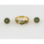 Emerald and diamond wave ring, channel set round cut emeralds and round brilliant cut diamonds,