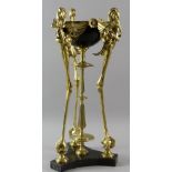 19th/20th century French black enamelled cup on central gilt bronze column and three gilt bronze