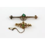 Edwardian brooch set with peridot, ruby, and pearl, mounted in yellow metal stamped 15 ct, measuring