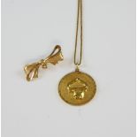Taurus pendant, in yellow metal testing as 18 ct, with box chain, measuring approximately 69cm in